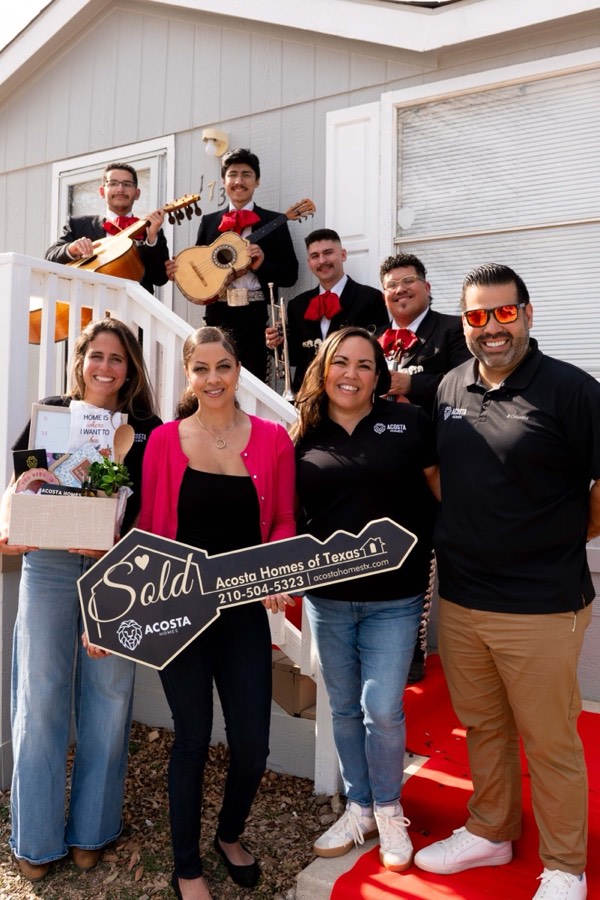 Acosta customers celebrating their closing with mariachis, a gift basket, and the Sold key