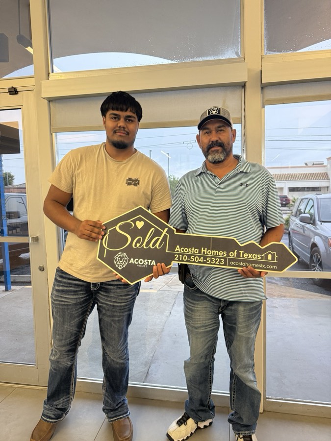 Two Acosta customers holding the Sold key at closing