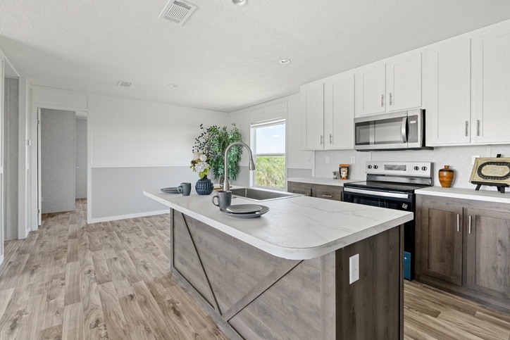 Kitchen island and white shaker cabinets