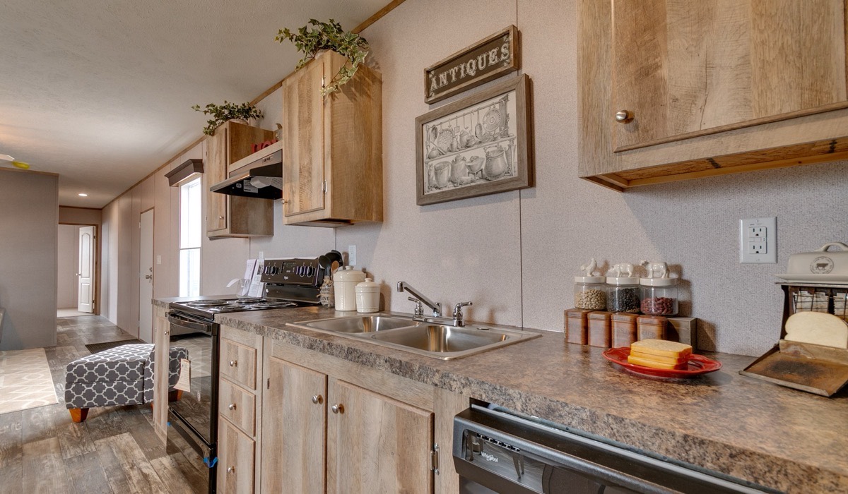 Kitchen with wood cabinets inside the new single-wide